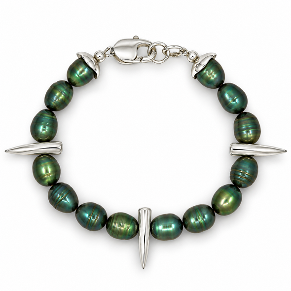 A silver-toned beaded bracelet featuring dark green iridescent baroque pearls and three silver spike charms, displayed on a clean white background.