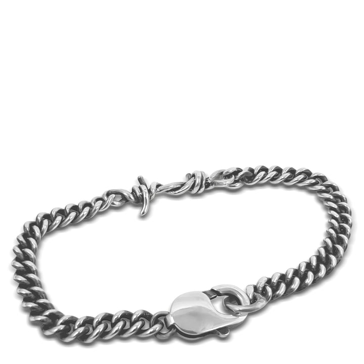 Silver chain bracelet on a white background