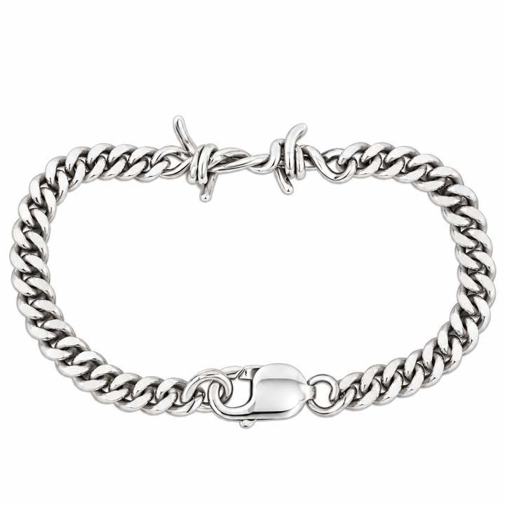 A silver-toned metal curb link bracelet with a polished barbed clasp and a lobster clasp closure, shown on a plain white background.