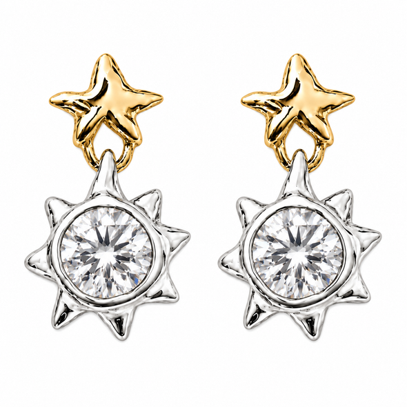 A pair of gold and silver dangle earrings, each featuring a polished gold star stud connected to a silver sunburst pendant with a clear round-cut center stone, shown on a plain white background.