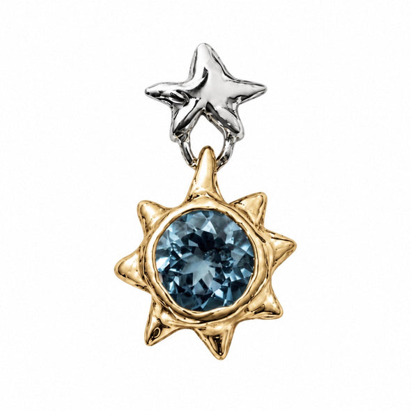 A two-tone star pendant featuring a polished silver star at the top and a gold starburst below, both surrounding a round faceted blue gemstone, shown on a plain white background.