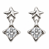 A pair of silver-toned drop earrings, each featuring a small star-shaped stud above a larger four-pointed star setting holding a round brilliant-cut clear gemstone, shown on a plain white background.