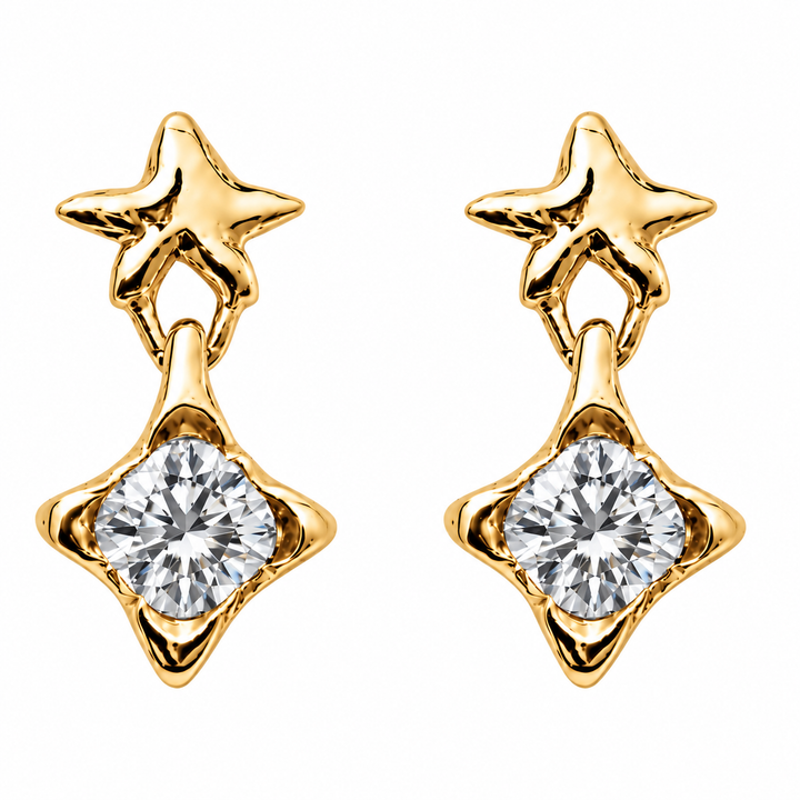 A pair of gold starburst stud earrings with a round clear gemstone in a four-pointed star setting, shown on a plain white background.
