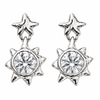 A pair of silver-toned dangle earrings featuring a five-pointed star at the top and a larger multi-pointed starburst shape below, each holding a clear faceted round gemstone, shown on a plain white background.