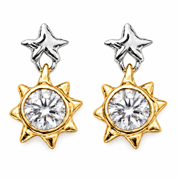 A pair of two-tone star and sun pendant earrings. Each earring features a textured silver star stud connected to a gold sunburst pendant with a round clear gemstone in the center, set against a plain white background.