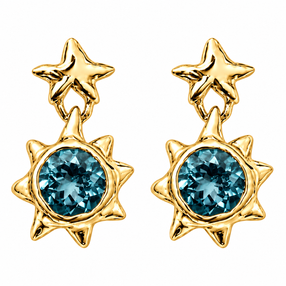 A pair of gold starburst dangle earrings with round blue gemstones, shown on a plain white background.