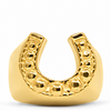 A gold horseshoe-shaped mouthguard with a textured beaded inner curve, shown on a clean white background.