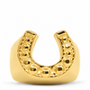 A gold horseshoe-shaped mouthguard with a textured beaded inner curve, shown on a clean white background.