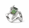 A silver ring with a sculptural, flowing band and a rectangular green gemstone in a bezel setting, shown on a white background.