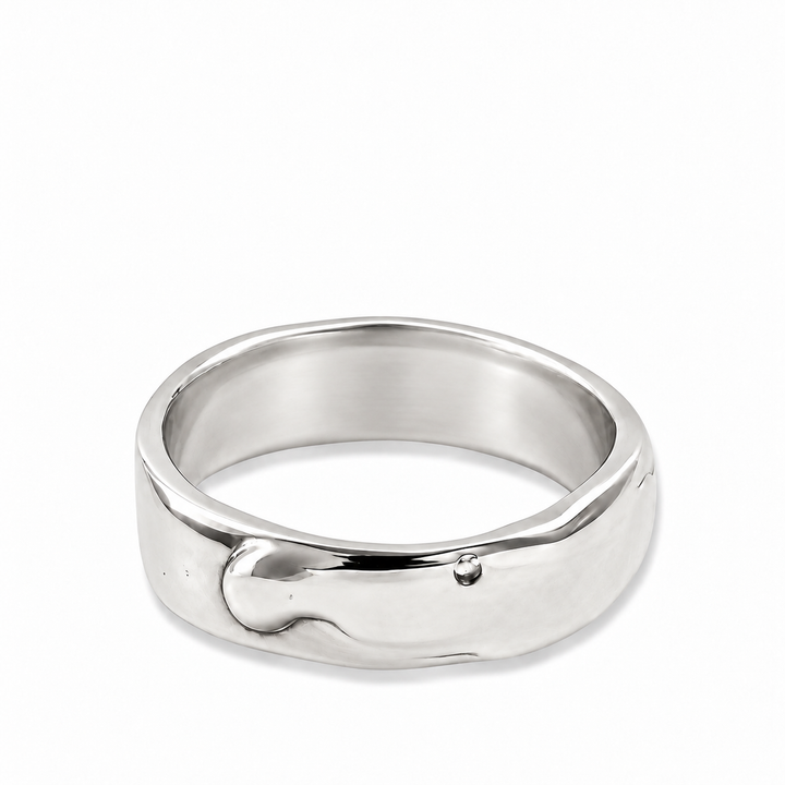 A polished silver band ring with an organic, wavy, fluid-like textured design, shown on a clean white background.
