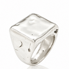 A sterling silver signet ring with a heavily textured, organic square face and a polished band, shown on a clean white background with a soft reflection.