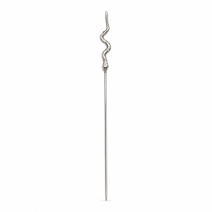 A silver-toned cocktail pick with a sculpted, wavy snake head on a plain white background.