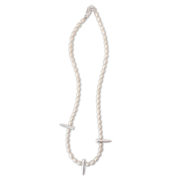 Pearl necklace with silver pendants on a white background