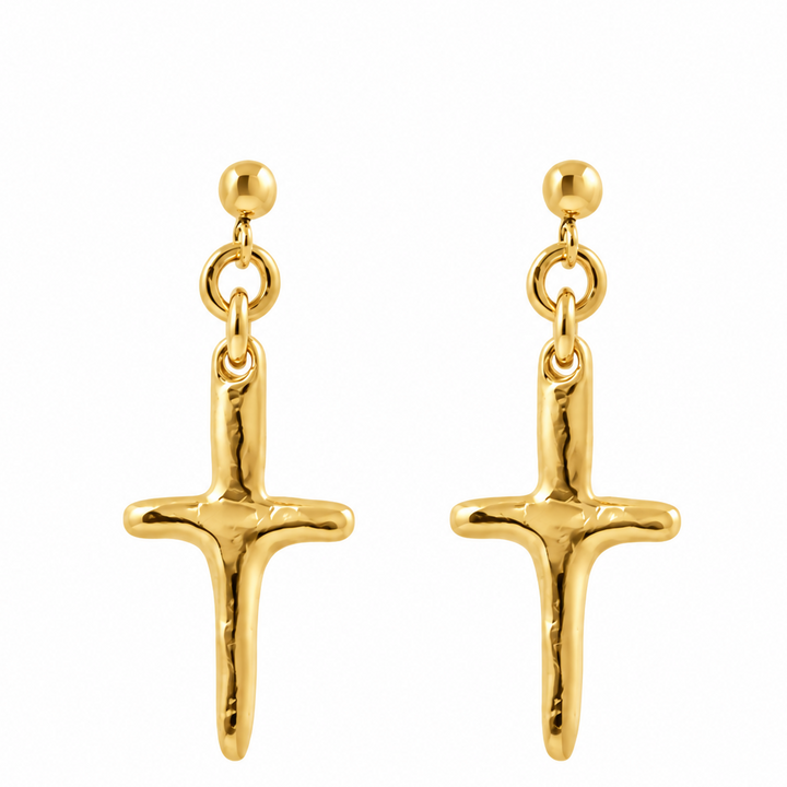 A pair of gold cross dangle earrings with textured, hammered finishes and spherical post backings, shown on a plain white background.