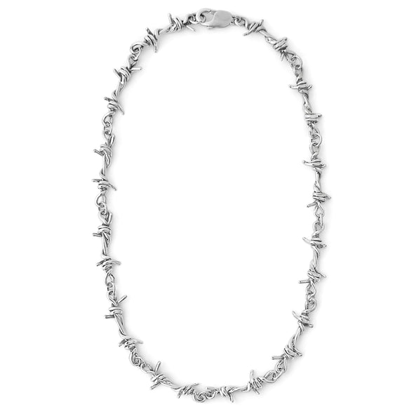 Silver barbed wire necklace on a white background