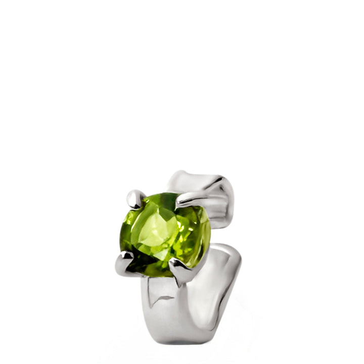 Silver ring with a green gemstone on a white background