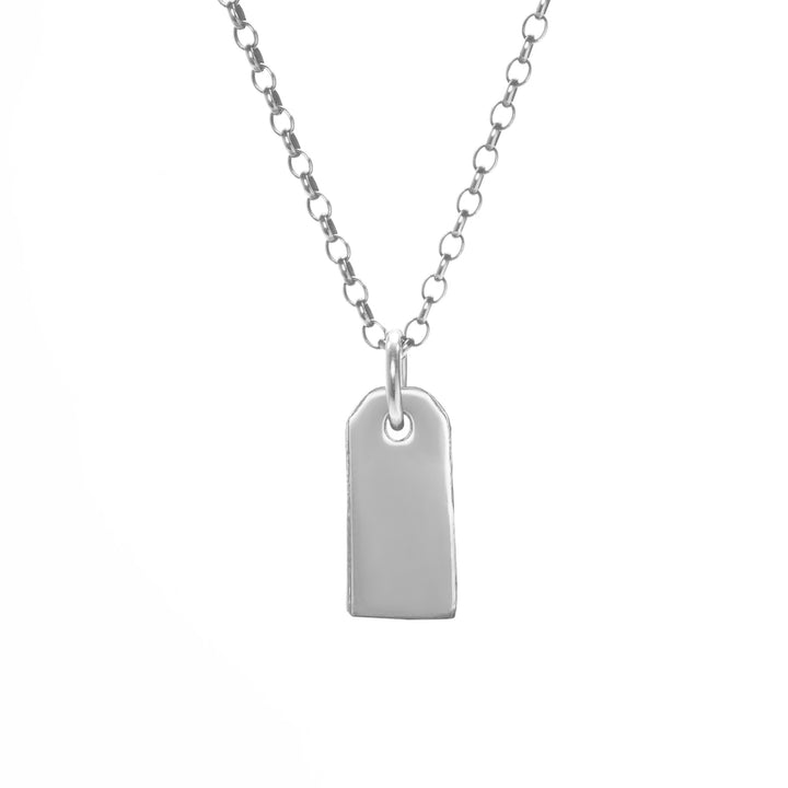 Silver necklace with a tag pendant on a white background