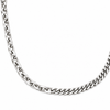 A close-up of a polished silver-tone curb chain necklace on a plain white background.