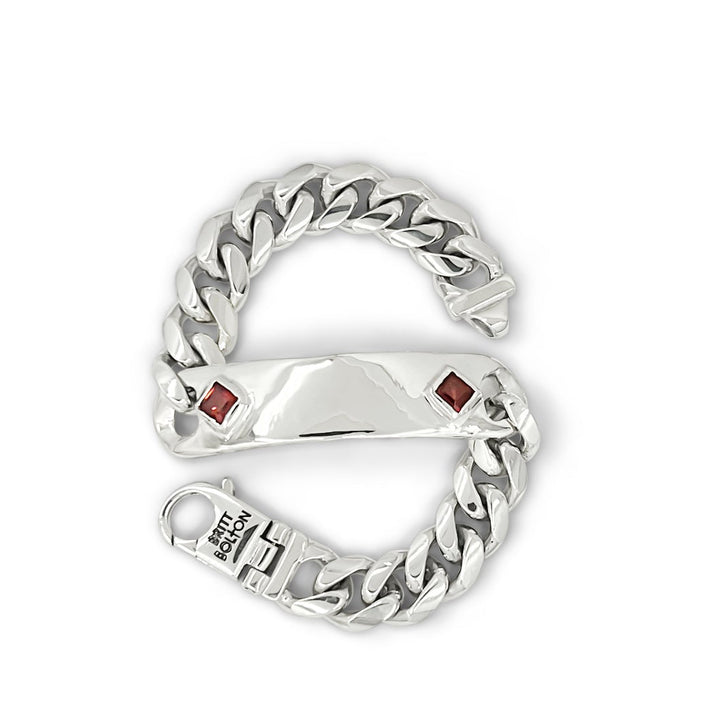Silver chain-style bracelet with embedded stones on a white background