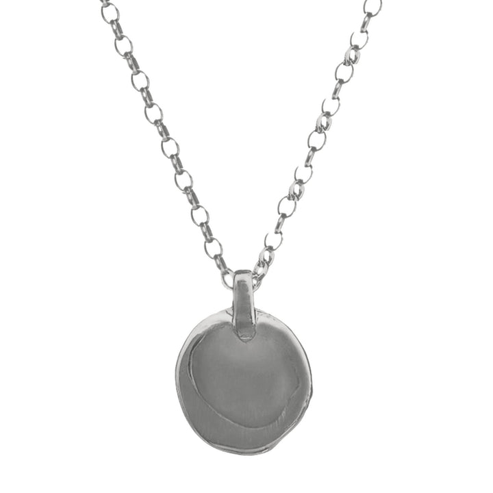 Silver necklace with a round pendant on a white background