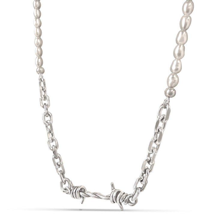 Pearl necklace with a barbed wire accent on a white background
