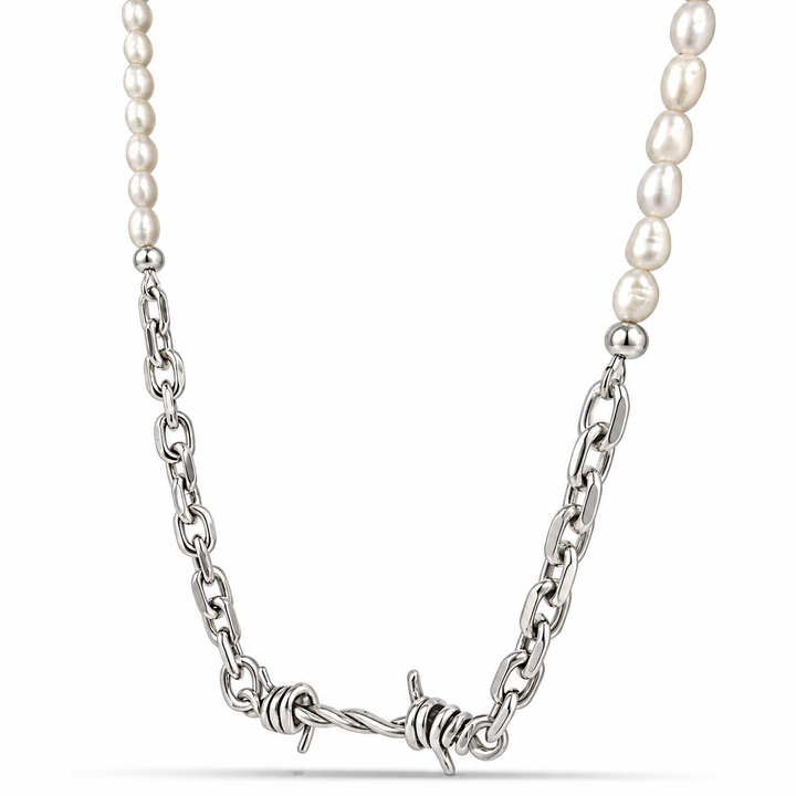 A silver-tone barbed wire chain necklace paired with white baroque pearls on both ends, displayed against a clean white background.
