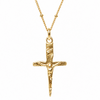 A textured gold crucifix pendant necklace on a delicate gold chain, shown against a plain white background.