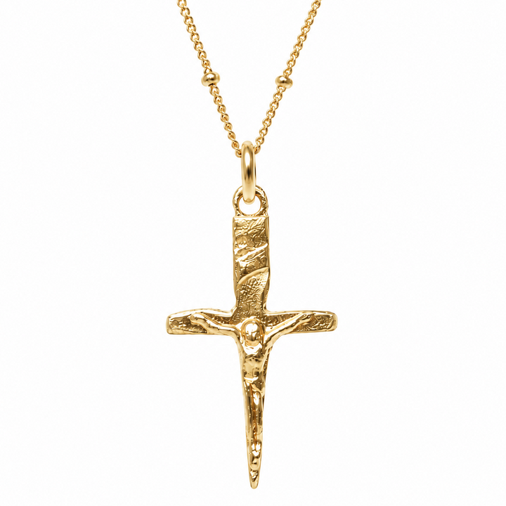 A textured gold crucifix pendant necklace on a delicate gold chain, shown against a plain white background.