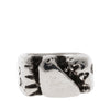 Silver ring with a textured design on a white background