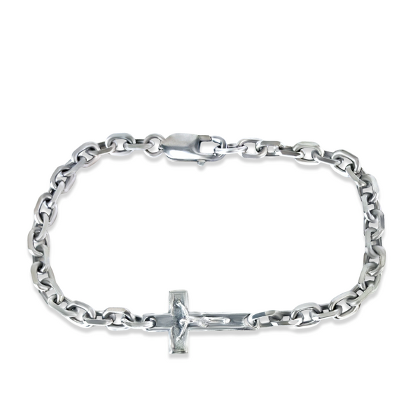 Silver chain bracelet with a cross charm on a white background
