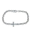 Silver chain bracelet with a cross charm on a white background