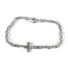 Silver chain bracelet with a cross charm on a white background