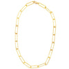 A gold-filled paperclip chain necklace laid out on a plain background.