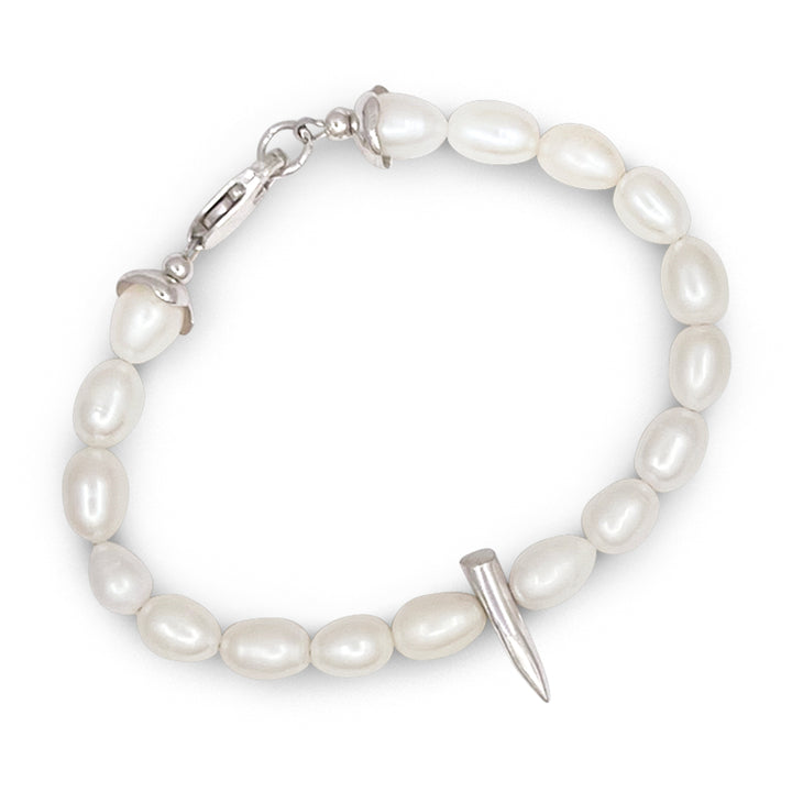 Pearl bracelet with a silver clasp on a white background