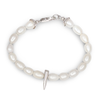 Pearl bracelet with a silver spike charm on a white background
