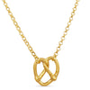 Gold necklace with a unique pendant on a white background