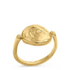 14k yellow gold signet ring which is a coin with a thin band. The coin has an image of an abstract mother mary with a cross engraved in it. shot on white background