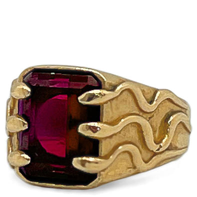 ruby gemstone entrapped by a fleet of snakes signet ring in solid gold