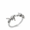 Silver ring with dolphin designs on a white background