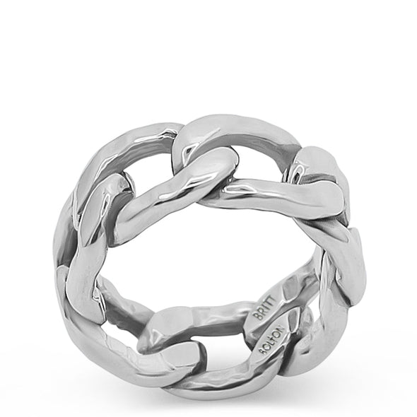 Silver ring with a braided design on a white background
