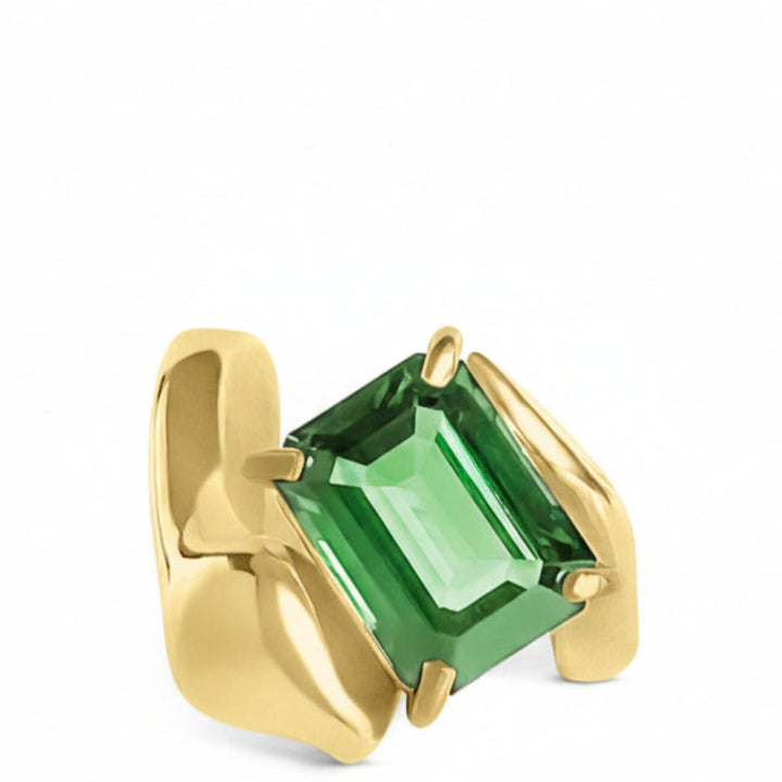 A 14k yellow gold ring with a green tourmaline gemstone, designed to look like a snake wrapped around the finger.