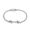 Silver bracelet with barbed wire design on a white background