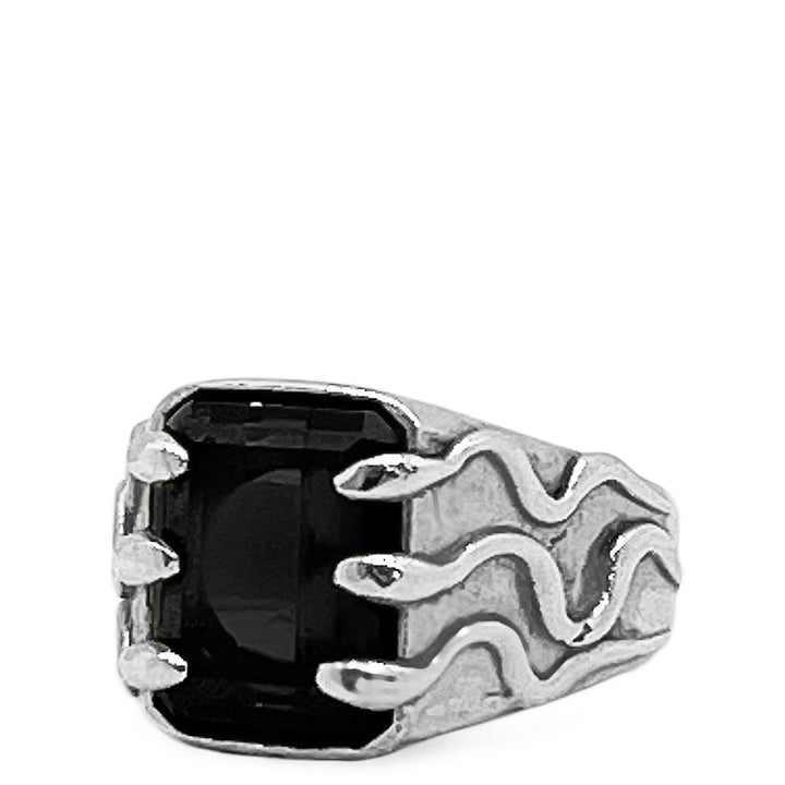 Silver ring with a black stone and snake designs on a white background