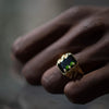 close up shot of hand with our Snake Signet Green Tourmaline Ring