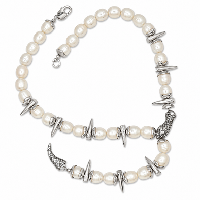 A pearl and silver beaded necklace featuring textured silver spikes, wing charms, and a small crescent moon charm, displayed on a clean white background.
