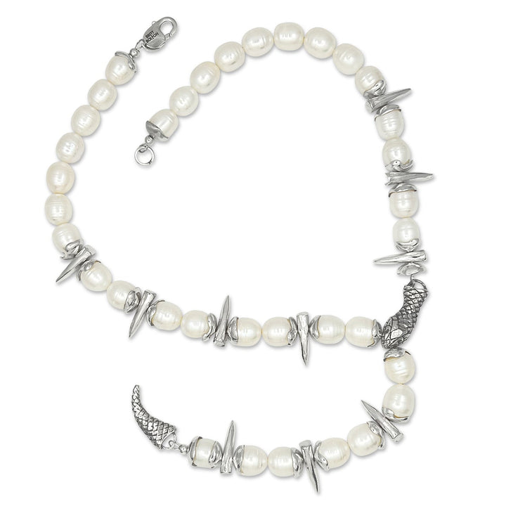 Pearl necklace with silver accents on a white background