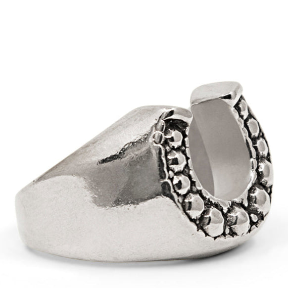 Silver ring with a unique design on a white background