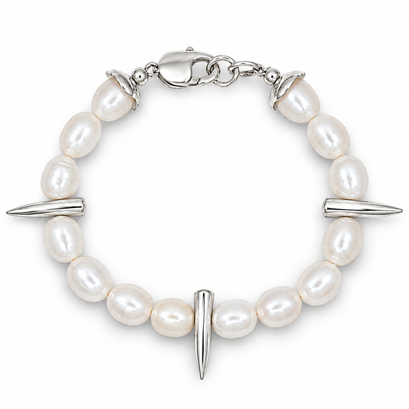 A silver-toned beaded bracelet featuring irregular white freshwater pearls, three polished spike charms, and a lobster clasp closure, shown on a clean white background.