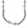 A silver-toned metal curb chain necklace featuring integrated barbed wire details, shown against a plain white background.