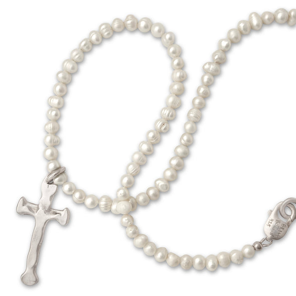 Pearl necklace with a cross pendant on a white background